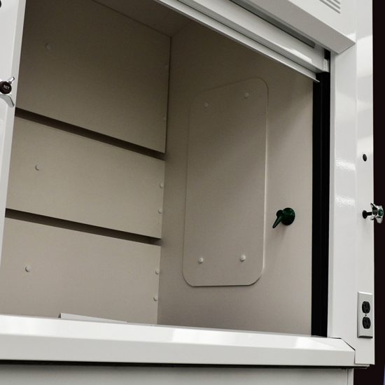 Interior angle showing the detail of a laboratory fume hood, model NLS-401, with a open sash window and a back baffle with slots for airflow