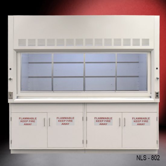 A laboratory fume hood with the sash window partially open, revealing the interior baffle system, and flanked by four safety storage cabinets.
