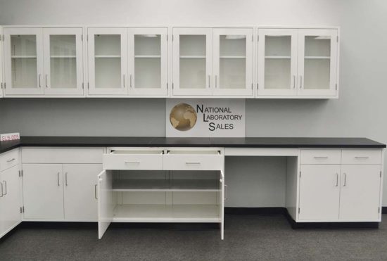 Open cabinets in lab display with wall unit