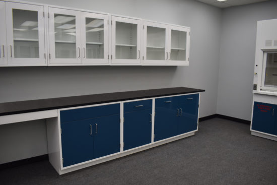 Blue laboratory cabinets will glass wall units.