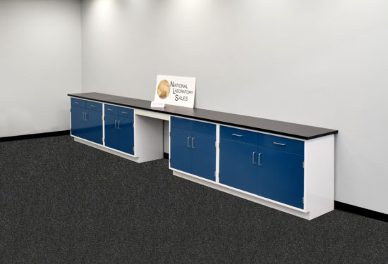 Blue laboratory cabinets with black epoxy work surface.