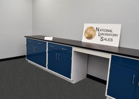 Blue laboratory cabinets with black epoxy work surface.