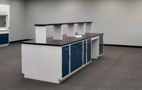 Laboratory island with desk area and center shelf.