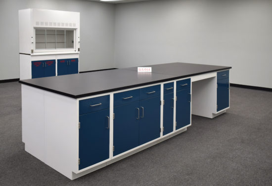 Laboratory island with desk area and black countertop.