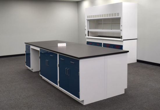 Laboratory island with desk area and black countertop.