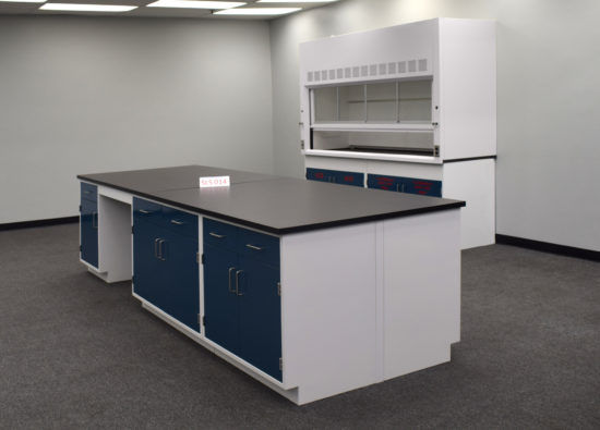 Laboratory island with desk area and black countertop.