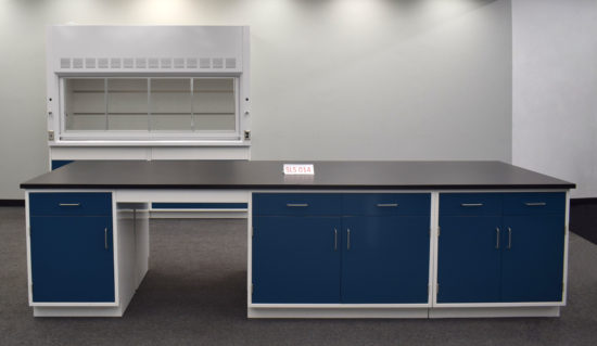 Laboratory island with desk area and black countertop.