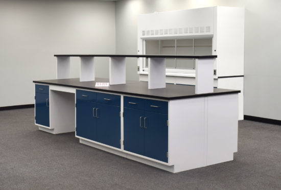 Laboratory island with desk area and center shelf.