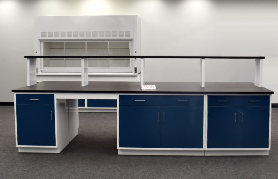 Laboratory island with desk area and center shelf.