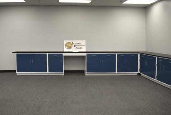 Blue laboratory cabinets with desk area.