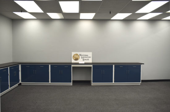 Blue laboratory cabinets with desk area.