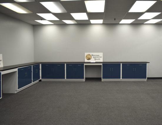 Blue laboratory cabinets with desk area.