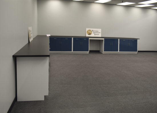 Blue laboratory cabinets with desk area.