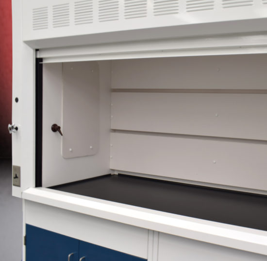 Fume hood and laboratory cabinet combination with two blue flammable storage cabinets.