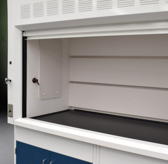 Fume hood and laboratory cabinet combination with two blue acid storage cabinets.