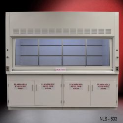 Laboratory fume hood, model NLS-833, manufactured by Fisher American. It features a work area with a wide viewing sash for easy access and visibility. Above the chamber are slats for air exhaust. Below the work area, there cabinets labeled "FLAMMABLE KEEP FIRE AWAY," designed for safe storage of flammable materials.