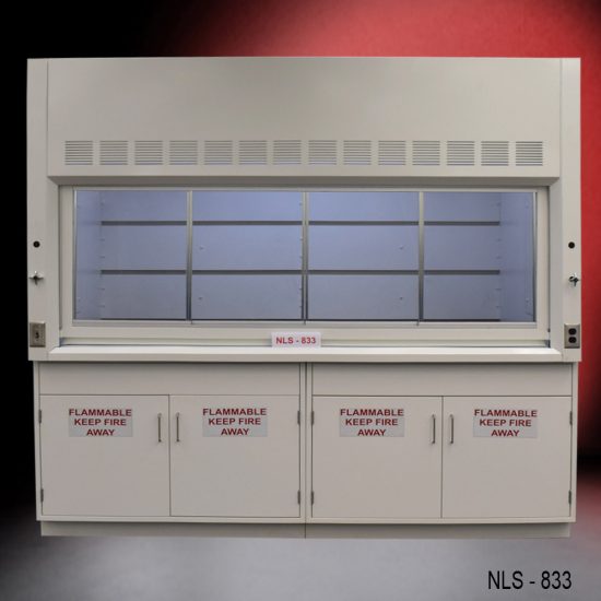 Laboratory fume hood, model NLS-833, manufactured by Fisher American. It features a work area with a wide viewing sash for easy access and visibility. Above the chamber are slats for air exhaust. Below the work area, there cabinets labeled "FLAMMABLE KEEP FIRE AWAY," designed for safe storage of flammable materials.