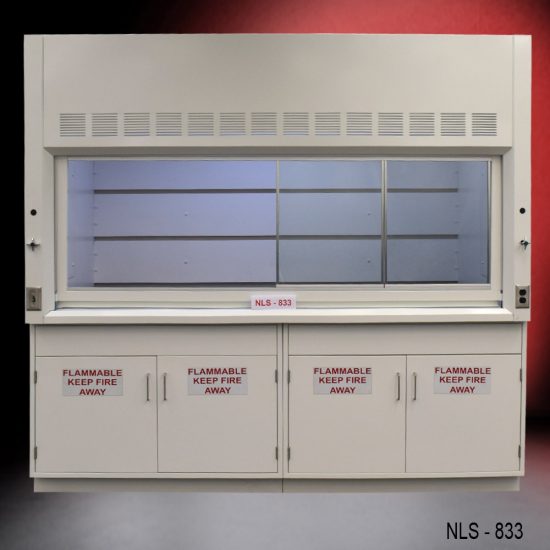 Laboratory fume hood, model NLS-833, manufactured by Fisher American. It features a work area with a wide viewing sash for easy access and visibility. Above the chamber are ventilation slats for air exhaust. Below the work area, there is cabinetry with double-door compartments labeled "FLAMMABLE KEEP FIRE AWAY," designed for safe storage of flammable materials.