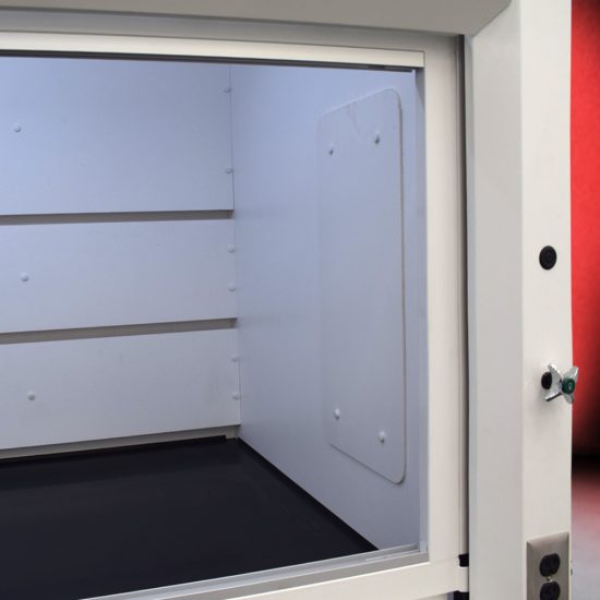 White fume hood with four blue acid storage cabinets.