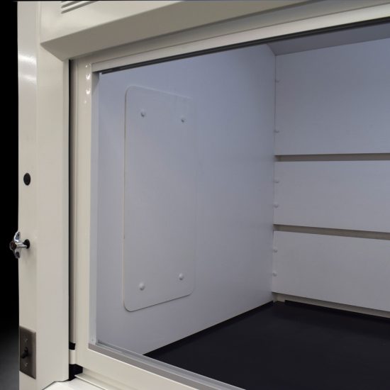 Interior view of Laboratory fume hood, model NLS-838, manufactured by Fisher American. It features a spacious work area with a wide viewing sash for easy access and visibility. Above the chamber are ventilation slats for effective air exhaust. Below the work area, there is cabinetry with blue double-door compartments labeled "FLAMMABLE KEEP FIRE AWAY," designed for safe storage of flammable materials. The fume hood has a robust build and is situated against a blue background.